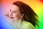 Beautiful woman in rainbow of light