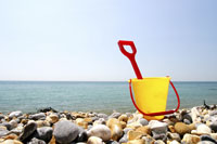 Child's bucket abandoned on beach