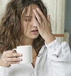 Woman holding coffee cup