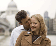 Couple kissing in front of St Paul's