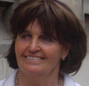 Close up of Baroness Cox, dark-haired and smiling
