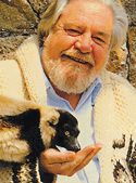Gerald Durrell with an animal eating out of his hand